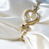 Retro Heart-shaped Bracelet Watch With A Golden Bow And Flow
